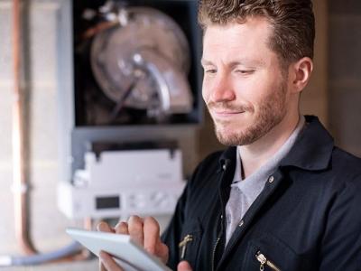 Man servicing boiler