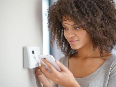 Woman with thermostat
