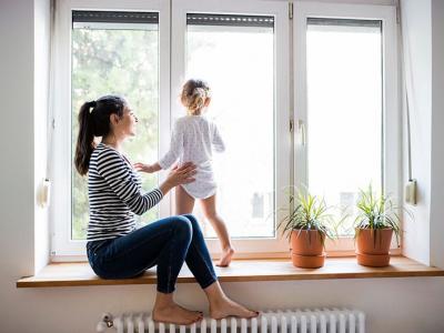 Women with feet on radiator