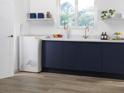 white boiler in blue kitchen